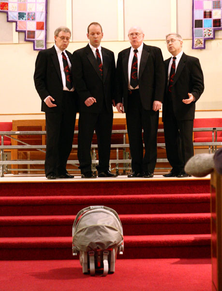The Father Figures quartet singing the song 'Kentucy Babe' to Matt's (the lead) new son.