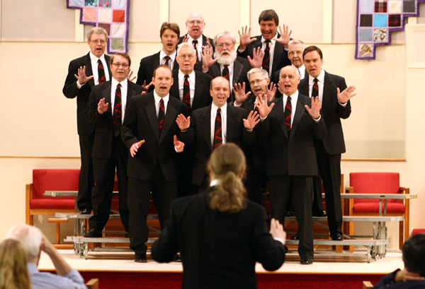 The Northern Stars Chorus performing a song.